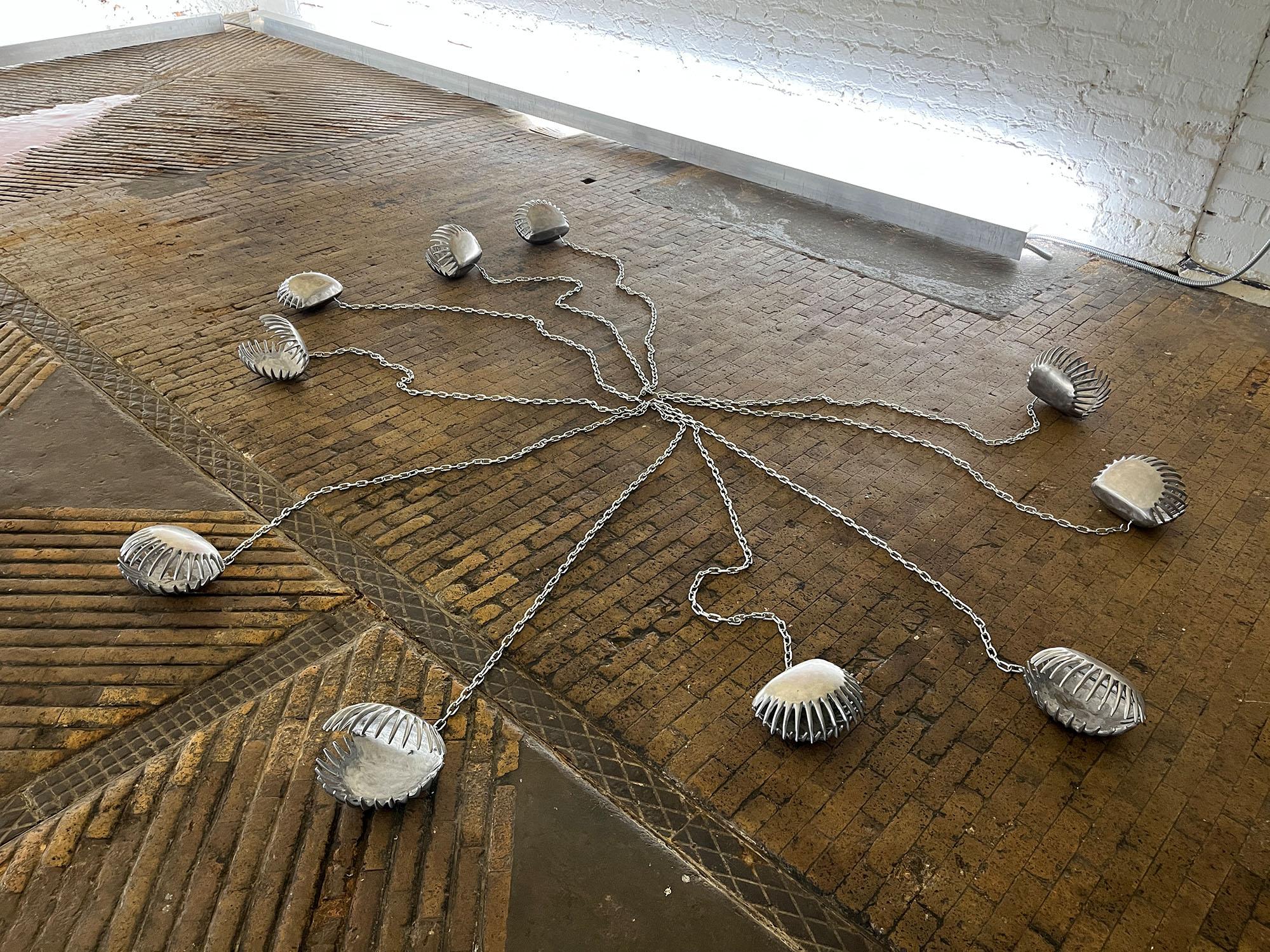 Nona Inescu, Venus traps (Dionaea muscipula), 2021, 10 metal shells with metal chain, variable dimensions